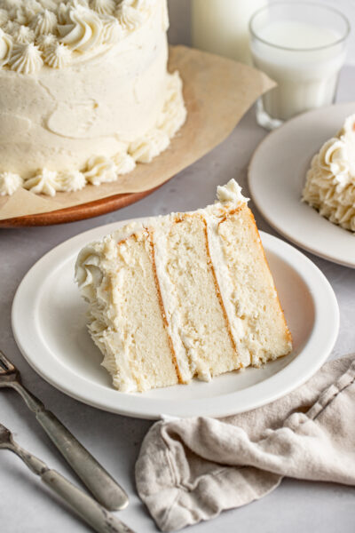 slice of white cake on a white dessert plate