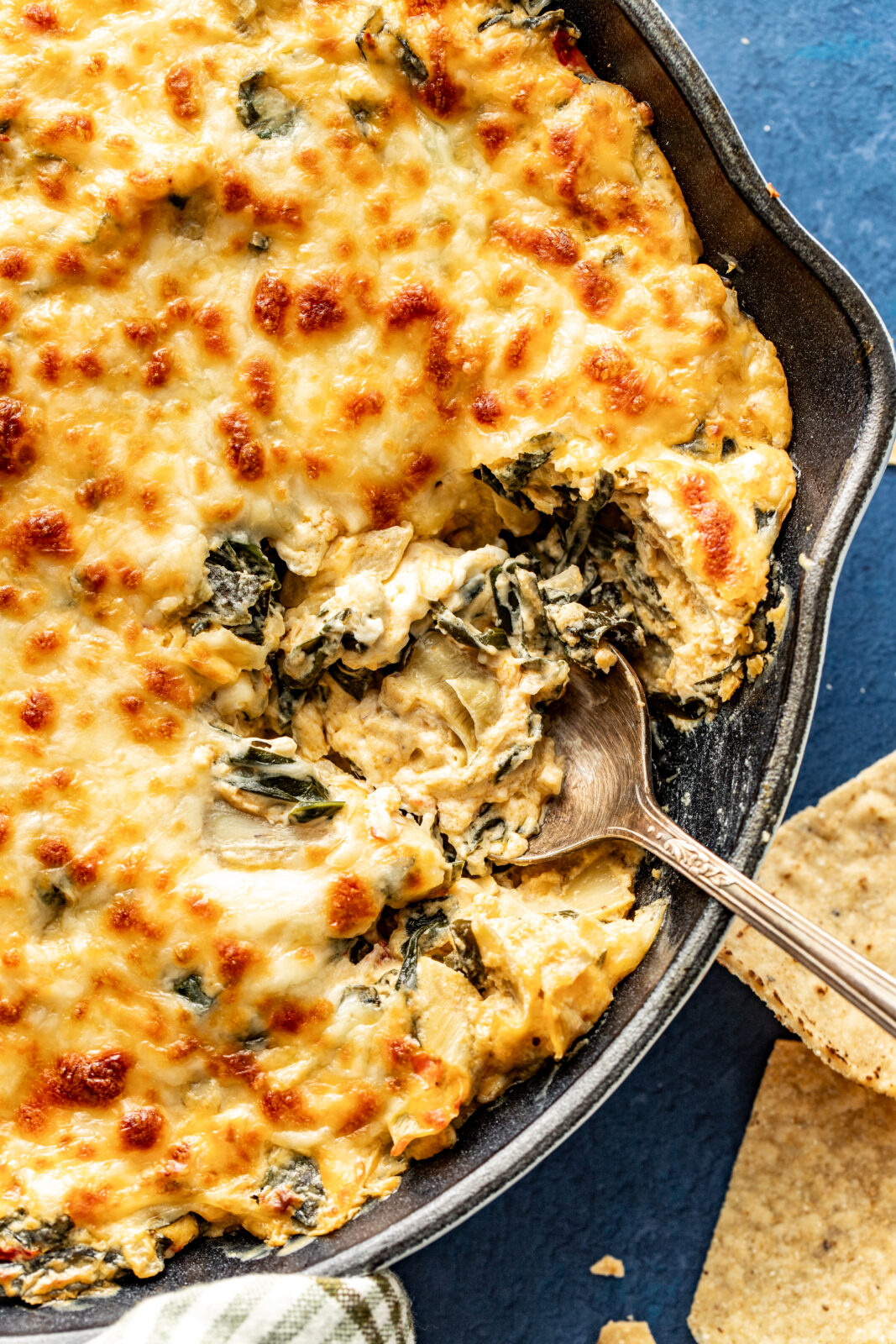 collard green dip with spoon in it