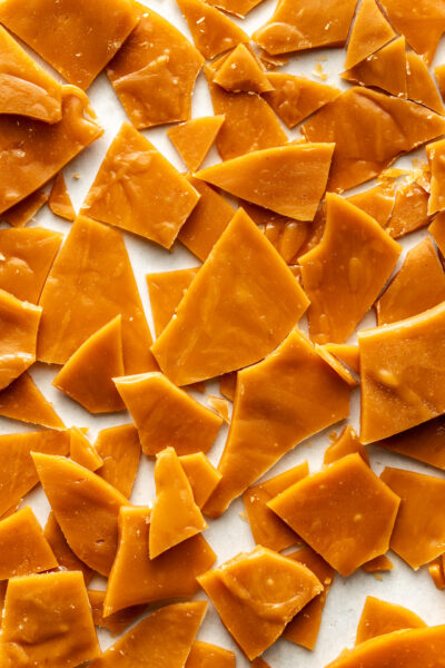 broken toffee on a baking sheet