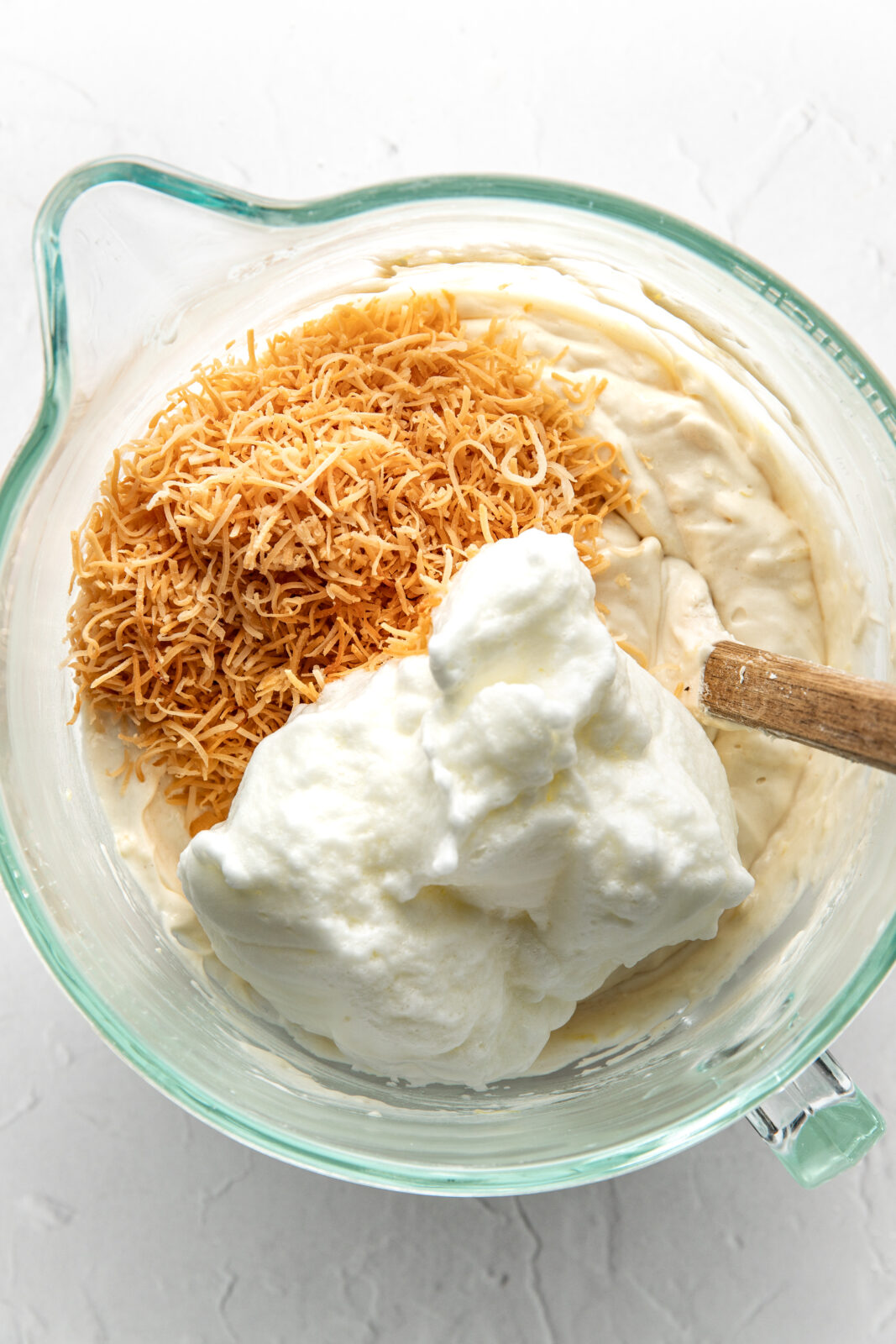 toasted coconut and whipped egg whites added to the cake batter