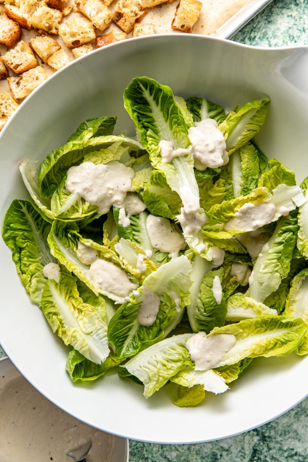 dressing added to lettuce