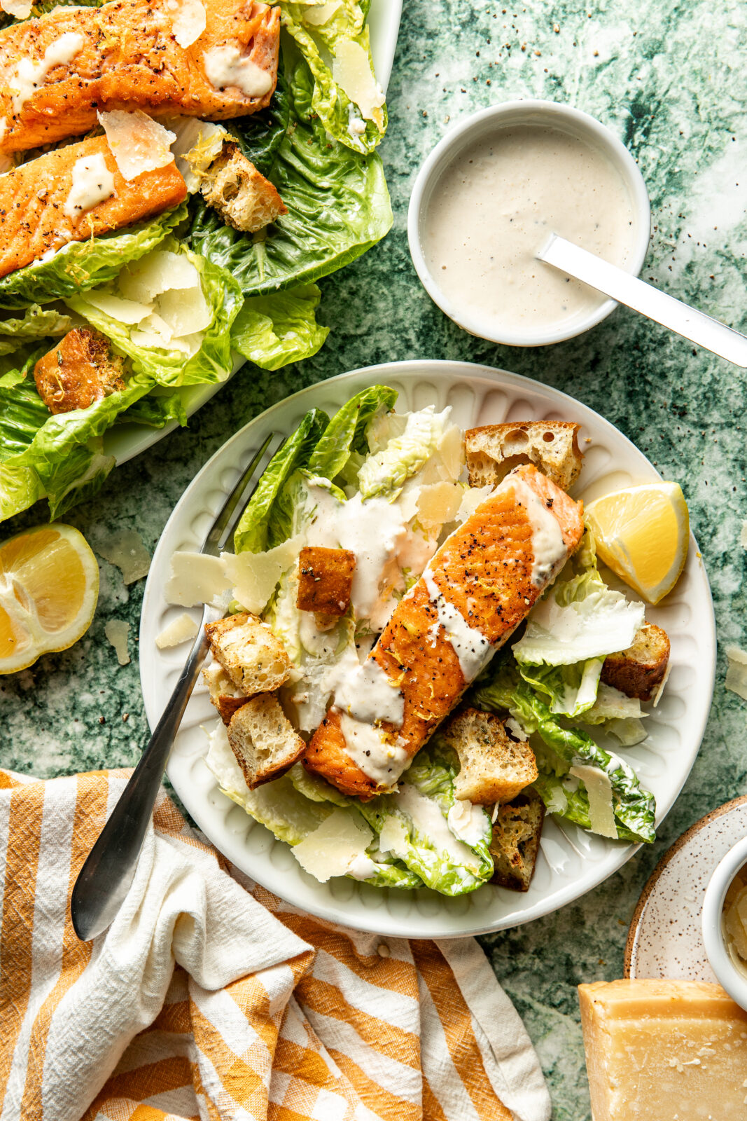 salmon caesar salad in plates