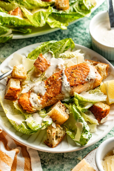 salmon caesar salad on plate