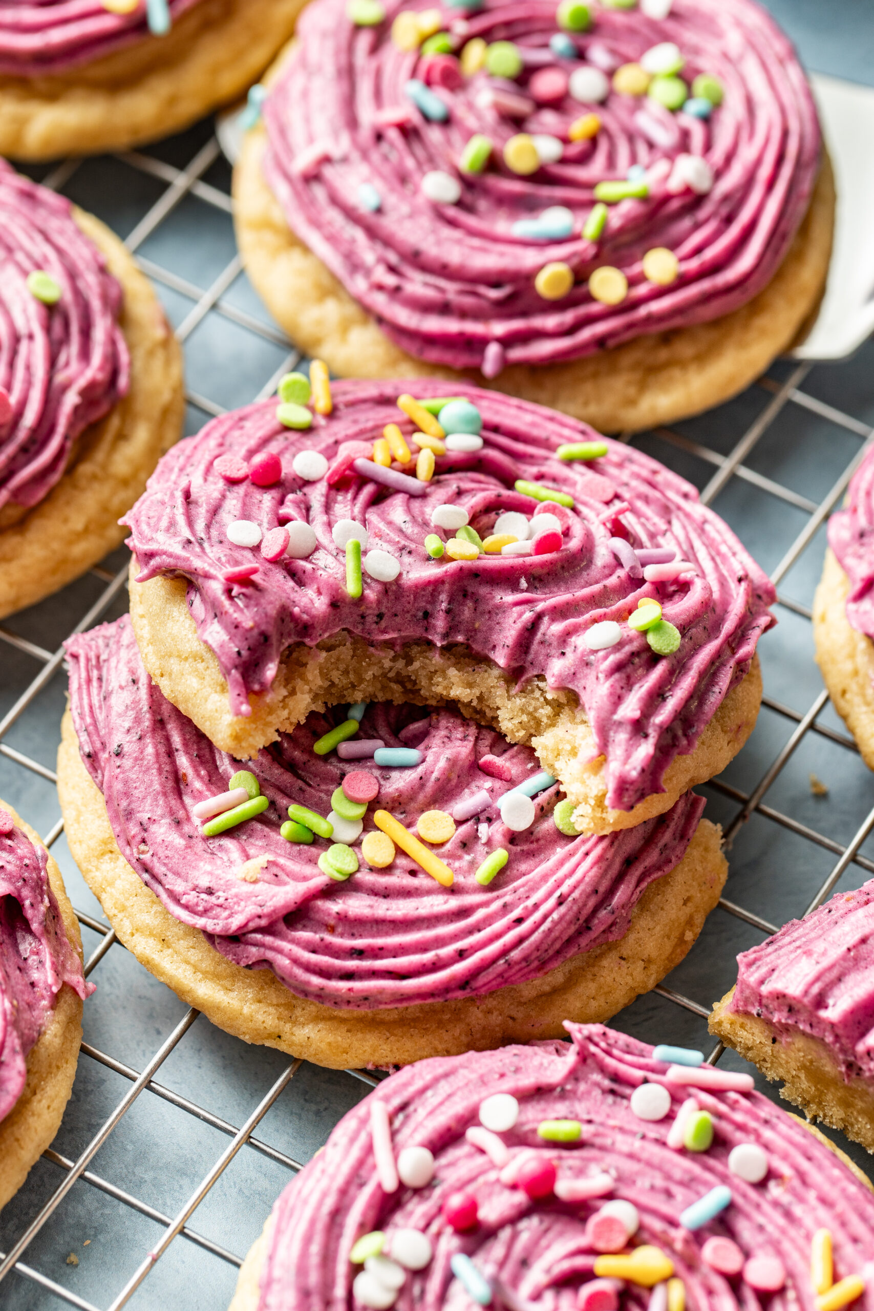 frosted sugar cookies stacked on top of each other