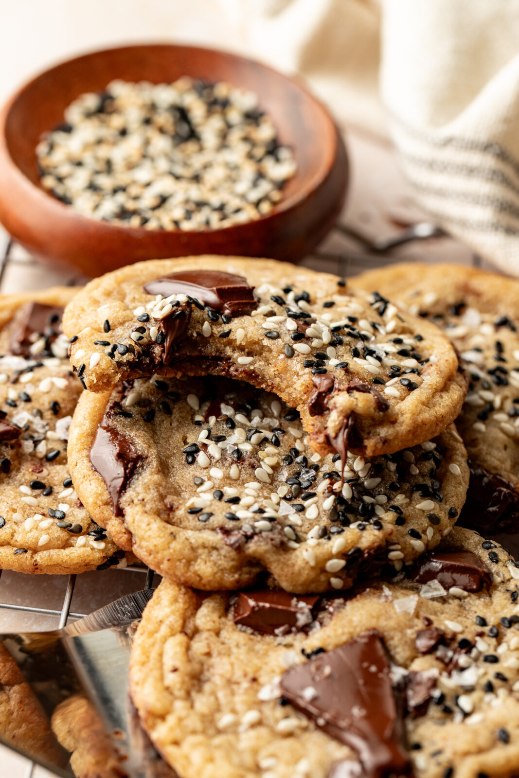 chocolate chip miso cookies with a bite taken out of one.