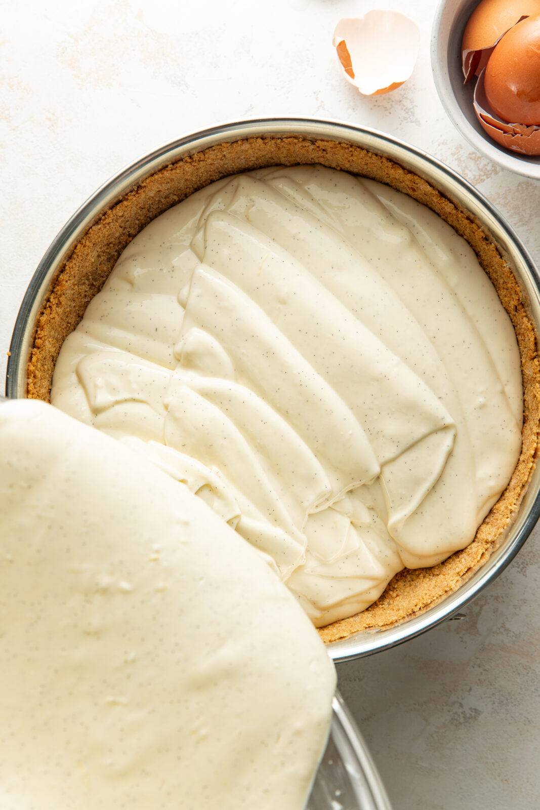 pour cheesecake base into cookie crust