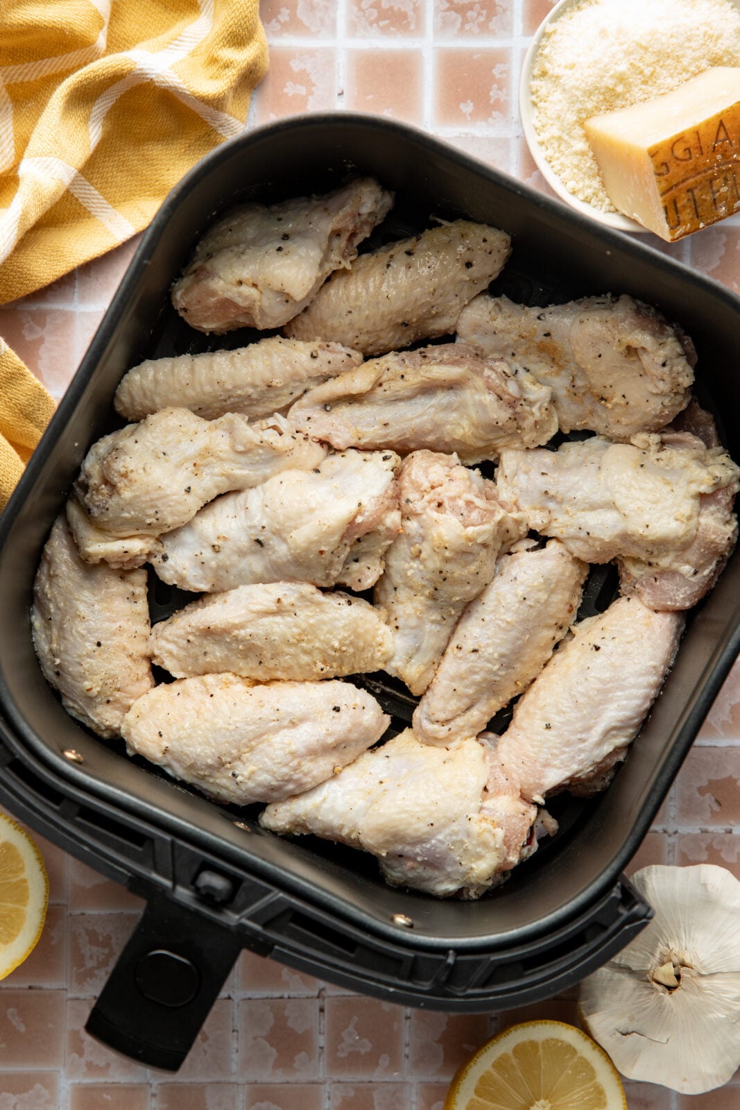 raw chicken in a single layer of a air fryer tray
