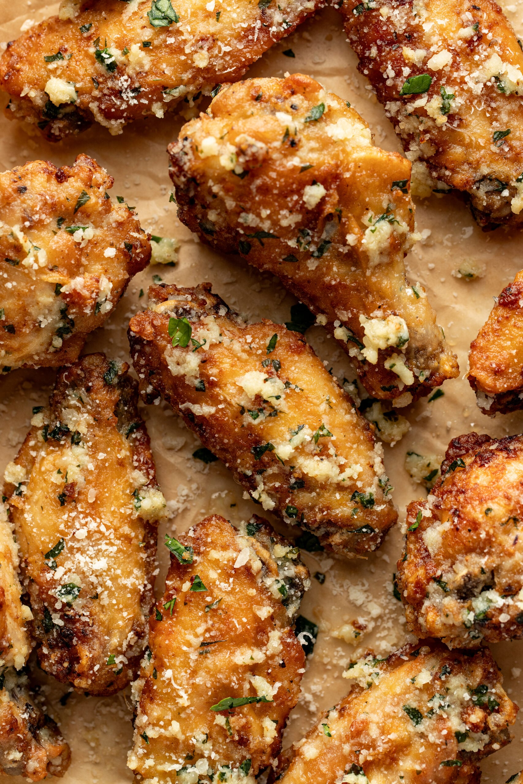garlic parmesan wings on parchment paper